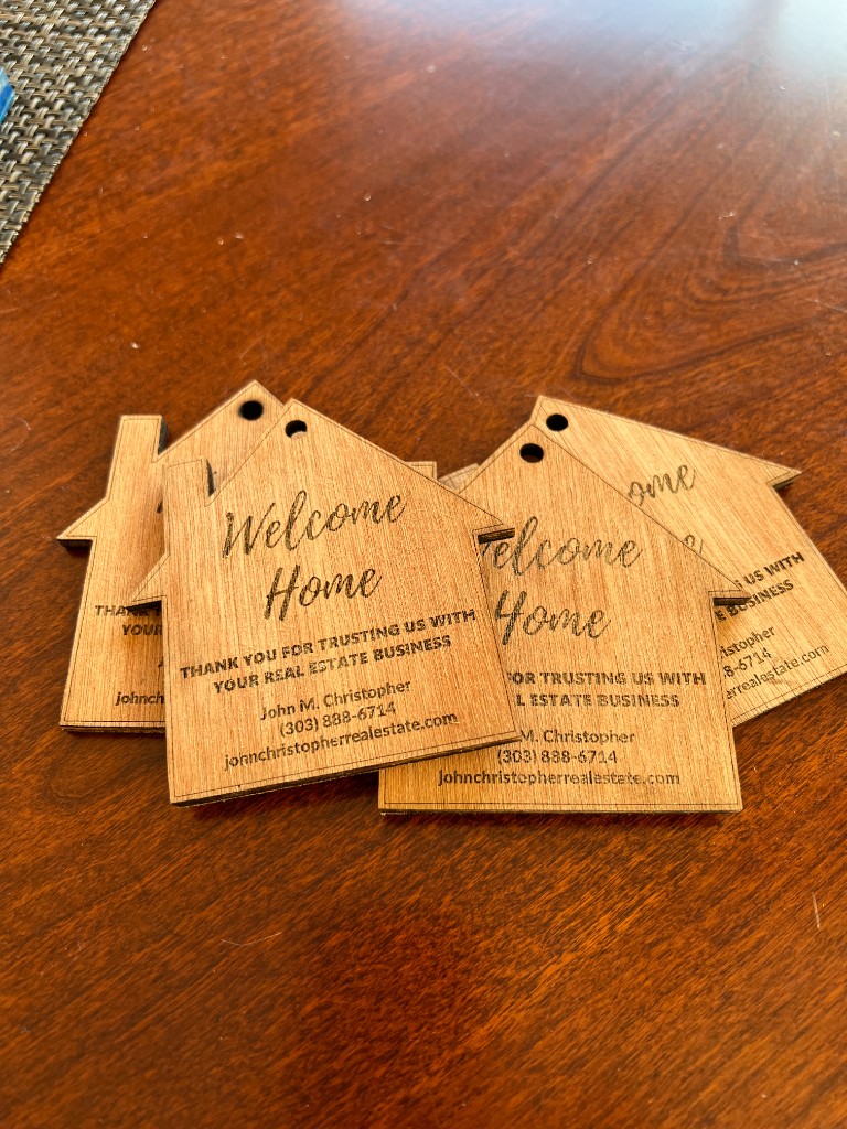 Custom Engraving: A custom laser-engraved keepsake shaped like the client’s new home. Realtors use them as a closing gift that actually gets kept, not tossed, a simple way to stay memorable long after the sale closes.